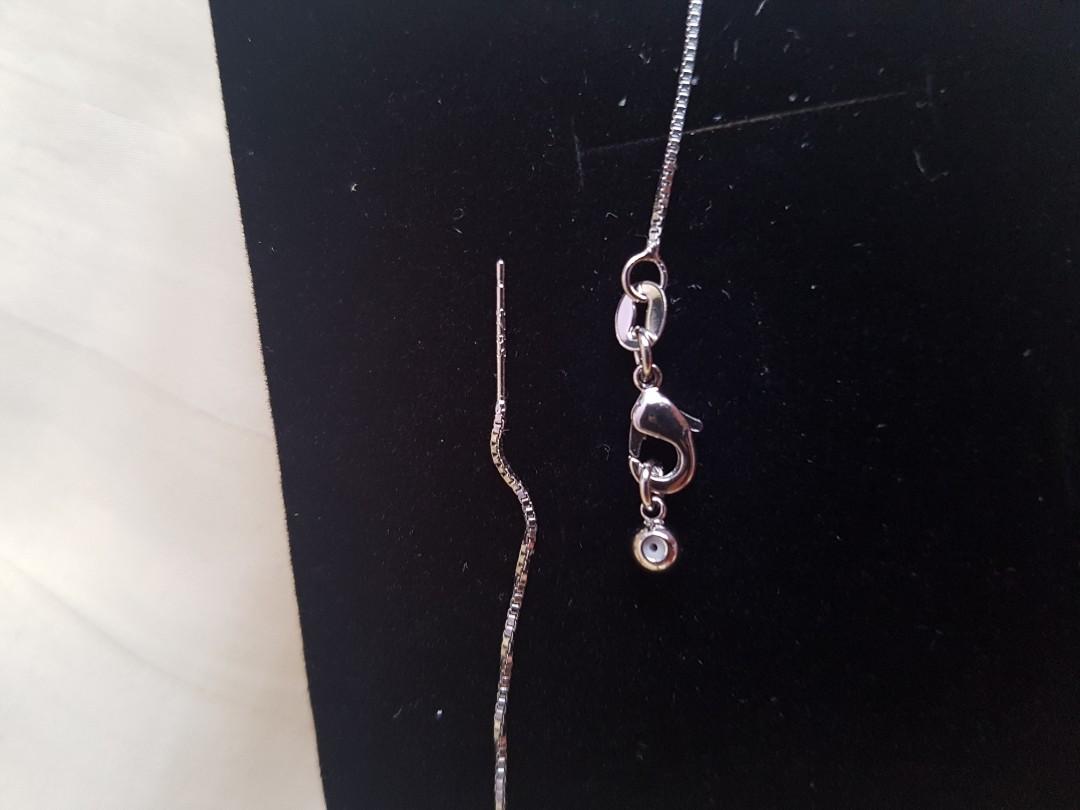 Brand New Silver Adjustable Costum Jewellery Necklace (Category: Necklaces) located in Singapore. Submitted by poohpoohdes (Listing ID 275491691, Image 2). Description: What you see is what length measuring to a total of 43.5cm as per picture. It us very versatile, you could adjust the length of your preference by pulling the end. Unlike other standard length necklace 😋 Seller says it's 925 silver but I cannot confirm it. It came with the costum