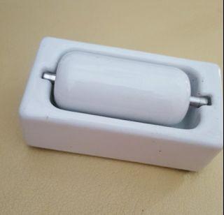 Vintage porcelain stamp/envelope roller moistener