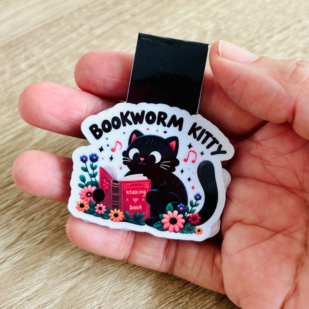 Handmade Bookworm Kitty Magnetic Bookmark (Category: Handmade Craft) located in Singapore. Submitted by happygreendoll (Listing ID 1319205657, Image 1). Description: Unique handmade magnetic bookmark for the bookworm kitty in you! Both sides laminated, image approximately 2 inches wide. Free normal mail included in price. .