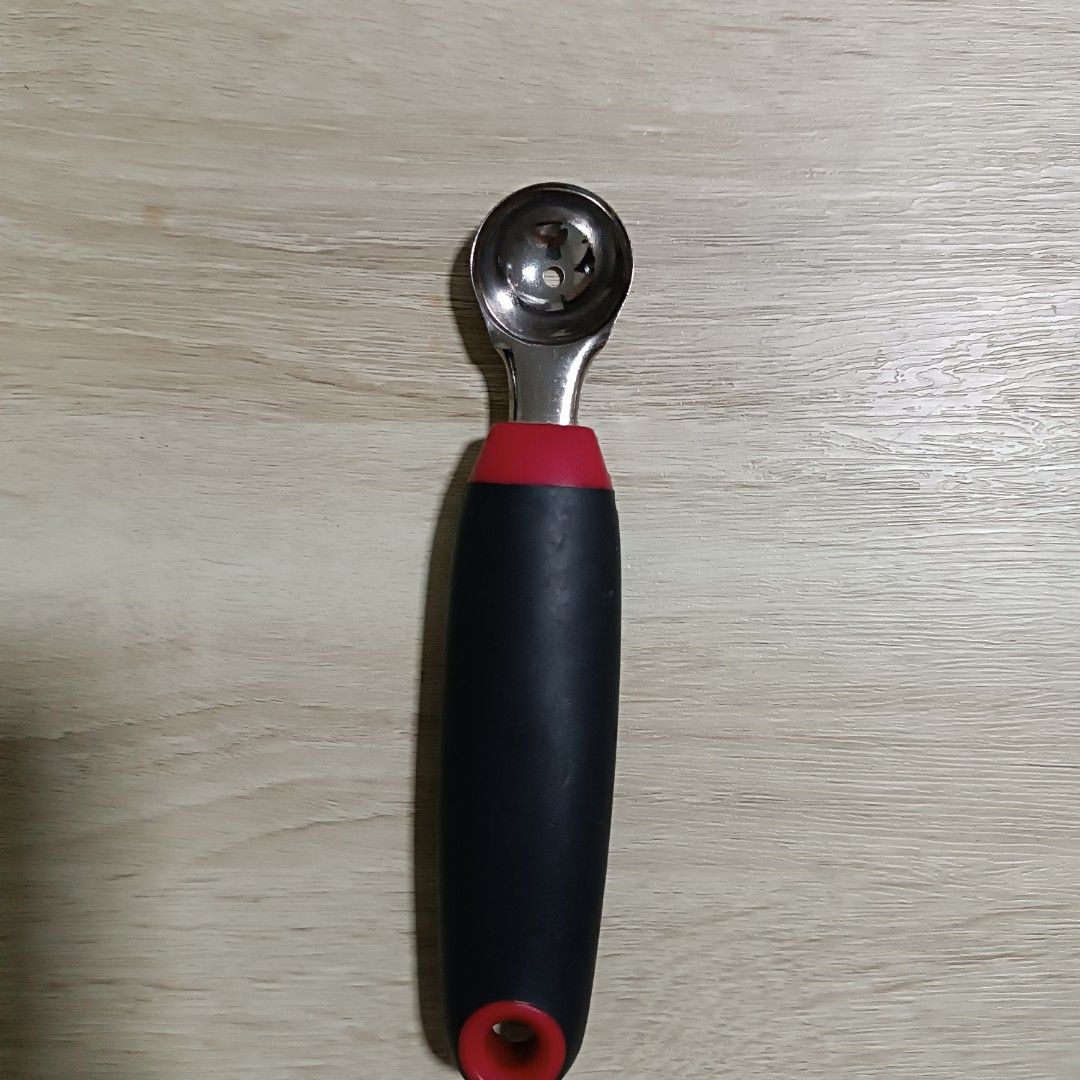 Fruit Scoop with Red and Black Handle (Category: Other Kitchenware & Tableware) located in Singapore. Submitted by aabbi306 (Listing ID 1400536407, Image 1). Description: - Perfect for creating melon balls and scooping fruits. - Comfortable, ergonomic handle. - Stylish red and black color scheme. - Made of durable stainless steel..