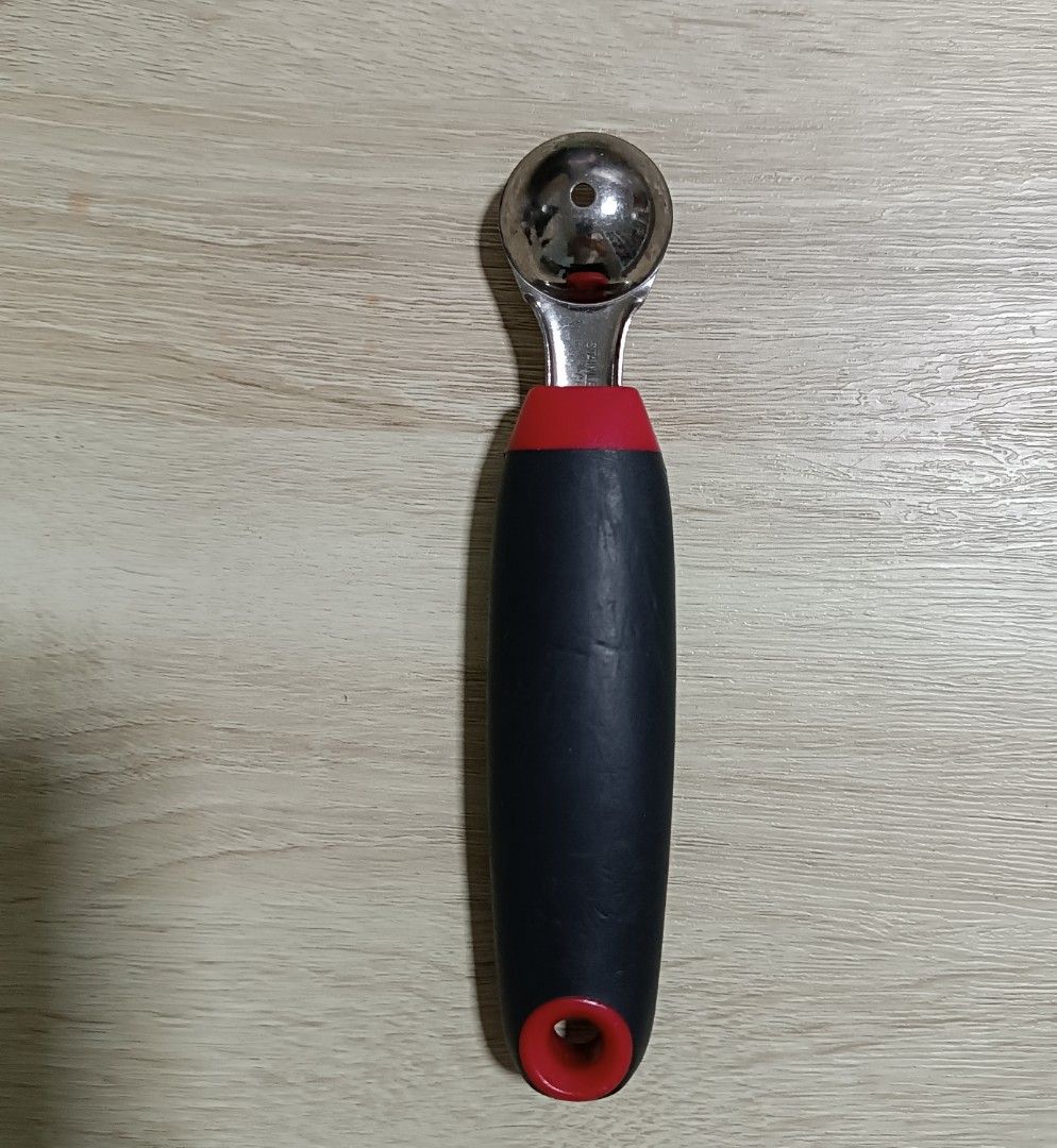 Fruit Scoop with Red and Black Handle (Category: Other Kitchenware & Tableware) located in Singapore. Submitted by aabbi306 (Listing ID 1400536407, Image 2). Description: - Perfect for creating melon balls and scooping fruits. - Comfortable, ergonomic handle. - Stylish red and black color scheme. - Made of durable stainless steel..