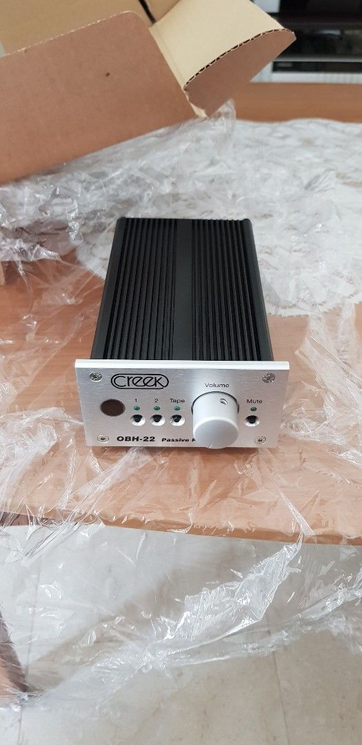 Creek OBH-22 Passive Pre-Amp (Control Pre Amp) (Category: Other Audio Equipment) located in Singapore. Submitted by lfran32 (Listing ID 1405010304, Image 3). Description: - Creek OBH-22 passive pre-amp - Includes original box, remote, operating instructions and original OBH 1 power supply. - Multiple inputs and outputs - Volume control and mute function - Auto power off once volume is selected for pure passive pass through to avoid any interferen