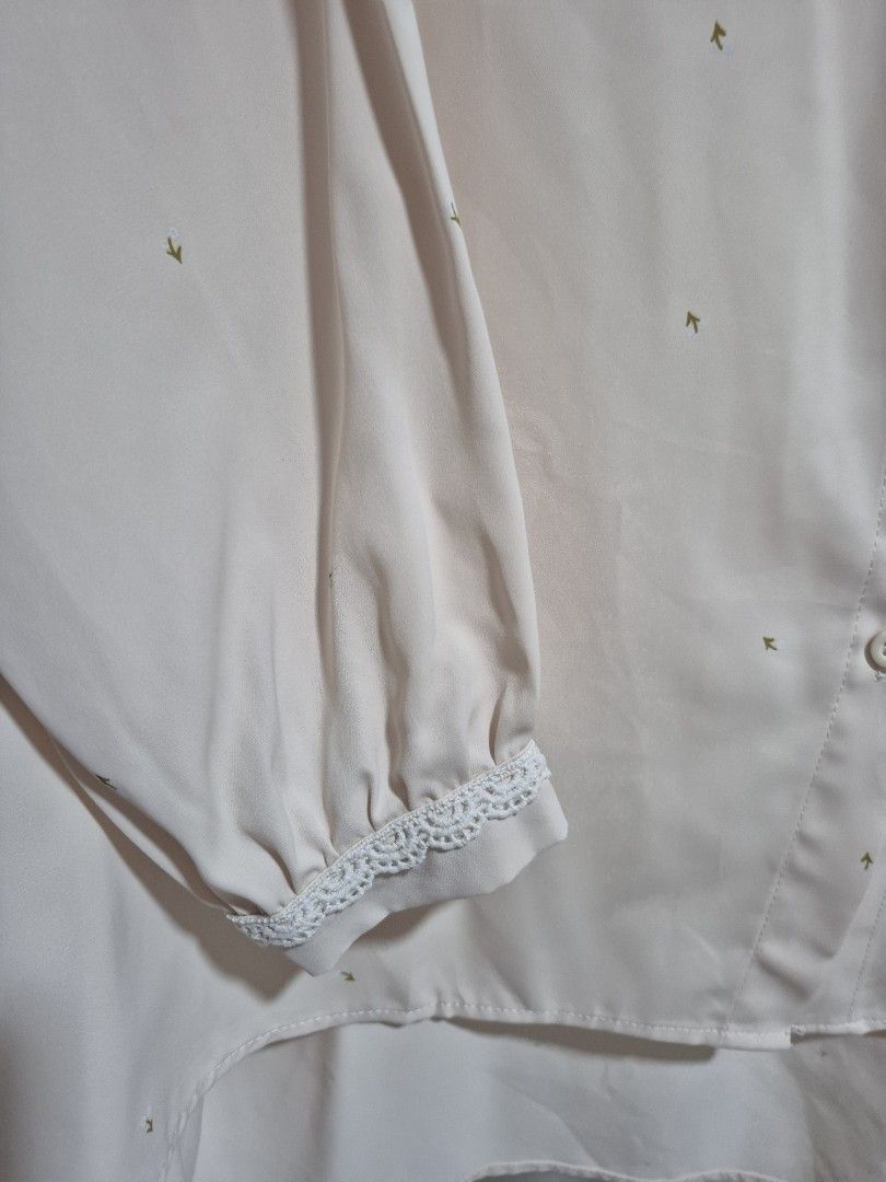 Deepduzt Vintage Cream Blouse with flower Print (Category: Blouses) located in Singapore. Submitted by hudhud2310 (Listing ID 1407121095, Image 5). Description: - ptp: 60cm, front length: 67cm, back length: 79cm - drop shoulder design - Vintage cream blouse - Delicate flower print - Button-down front - Long sleeves with lace detailing .