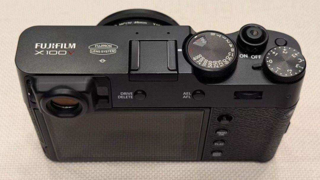 Fuji X100V black (Category: Cameras) located in Singapore. Submitted by oncelovedlenses (Listing ID 1381300214, Image 2). Description: Excellent condition, no issues, all functions working perfectly. Available for inspection. Includes battery, charger, and shoulder strap..