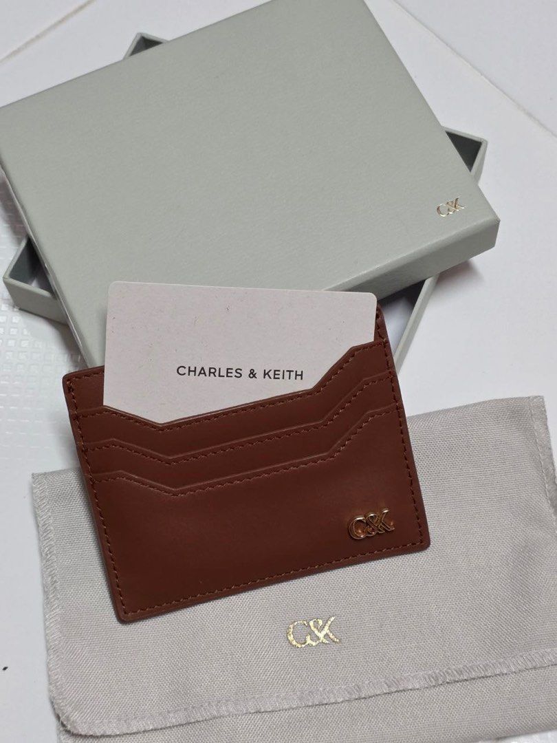 Charles & Keith Card Holder (Category: Wallets & Card Holders) located in Singapore. Submitted by iwbetaitai (Listing ID 1412420737, Image 1). Description: Brand new ! Comes with Dust pouch & Box ❤️ NO NEGO..