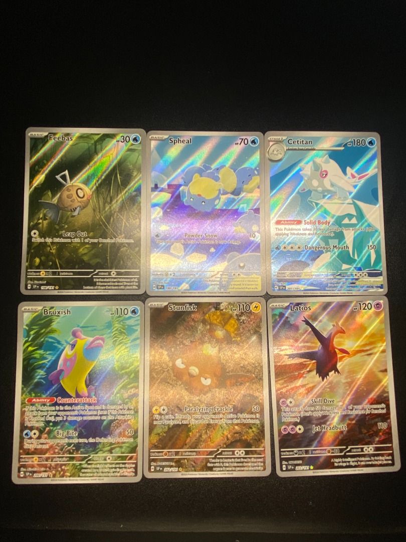 Pokémon Surging Sparks IR SET (Category: Raw Cards) located in Singapore. Submitted by collectorexclusive (Listing ID 1361629158, Image 2). Description: tiktok.com/@collector.exclusive Set for the following cards Exeggcute #192 Vivillon #193 Shiinotic #194 Castform Sunny Form #195 Larvesta #196 Ceruledge #197 Feebas #198 Spheal #199 Bruxish #200 Cetitan #201 Stunfisk #202 Latios #203 Mesprit #204 Phanpy #205 Vibrava #206 Clobbopus #207 Alolan Dug