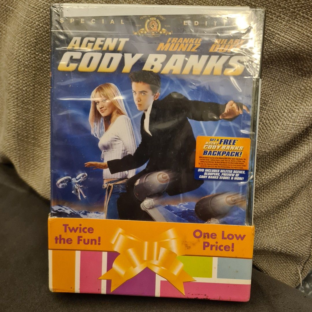 FREE TRACKABLE SHIPPING AND NEW AND SEALED! Value Pack of Agent Cody Banks and Afent Cody Banks 2 2-DVD 2 movie Special Editions Set starring Farnkie Muniz and Hilary Duff (Category: CDs & DVDs) located in Singapore. Submitted by doraguy (Listing ID 1369090360, Image 2). Description: Agent Cody Banks 2 movies in 1 pack. Rare. Stilled sealed and unused. Ships free with smartpac.
