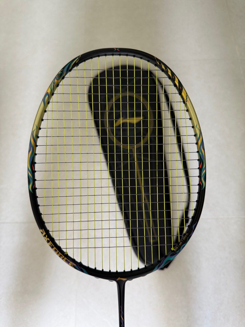 Li-ning Axforce 100 Black Gold 4UG5 (Category: Racket & Ball Sports) located in Singapore. Submitted by xleirbag (Listing ID 1392179266, Image 2). Description: Good like new. Well taken care off. Includes - Strung with Aerobite Boost, 25lbs x 27lbs - matching original racket bag No trading, nego possible but no low ballers please.