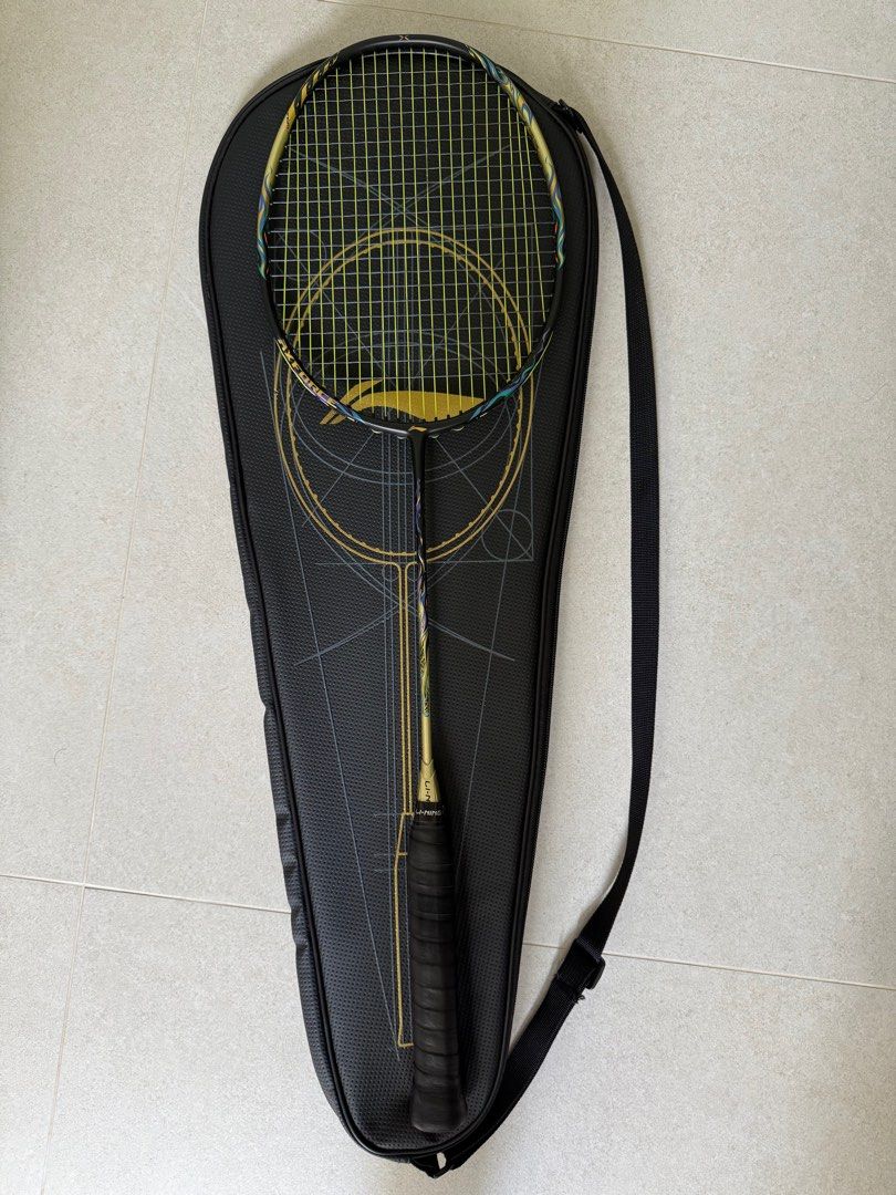 Li-ning Axforce 100 Black Gold 4UG5 (Category: Racket & Ball Sports) located in Singapore. Submitted by xleirbag (Listing ID 1392179266, Image 4). Description: Good like new. Well taken care off. Includes - Strung with Aerobite Boost, 25lbs x 27lbs - matching original racket bag No trading, nego possible but no low ballers please.