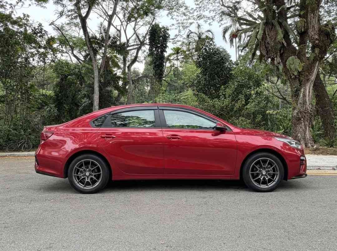 Kia Cerato 1.6 EX (A) (Category: Used Cars) located in Singapore. Submitted by carousellcars (Listing ID 1451203421, Image 3). Description: Well maintained and in excellent condition. Perfect for small family and ample boot space. Features: 1.6L DOHC engine, 6-speed automatic, cruise control, multi-function steering, reverse camera, keyless entry, Bluetooth connectivity. Accessories: New rims fitted Jan 2026 Sales Contact: Petrus Paul tel:9833036