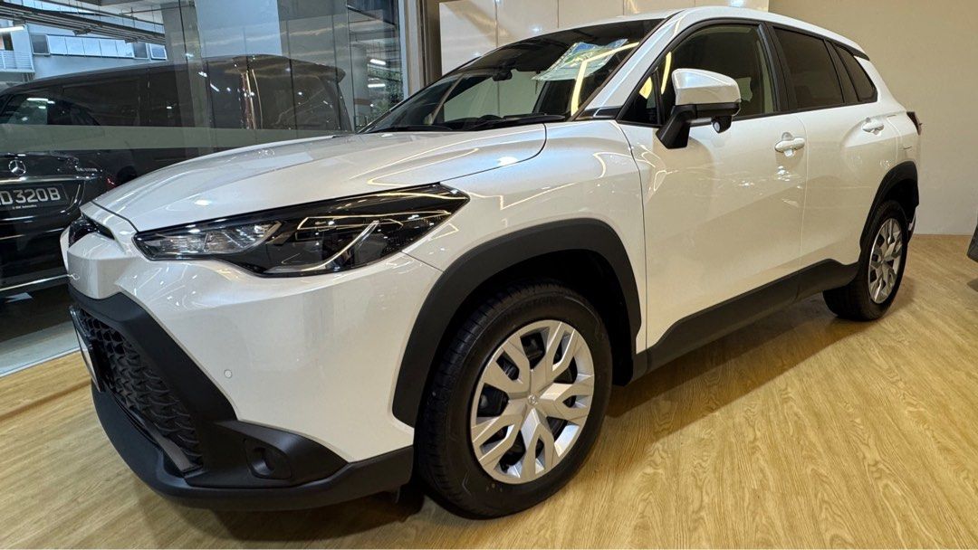 Toyota Corolla Cross 1.8A (Category: Parallel Imports) located in Singapore. Submitted by autozenbykenz (Listing ID 1414928783, Image 2). Description: Key Features & Specs: Powertrain: 1.8L Petrol Engine + Electric Motor with E-CVT Transmission. Power: Around 138 horsepower. Efficiency: Excellent fuel economy 26.2 km/L Technology: Toyota Safety Sense (Pre-Collision, Lane Departure Alert, etc.), 8-inch Multimedia System, Apple CarPlay/Android Auto