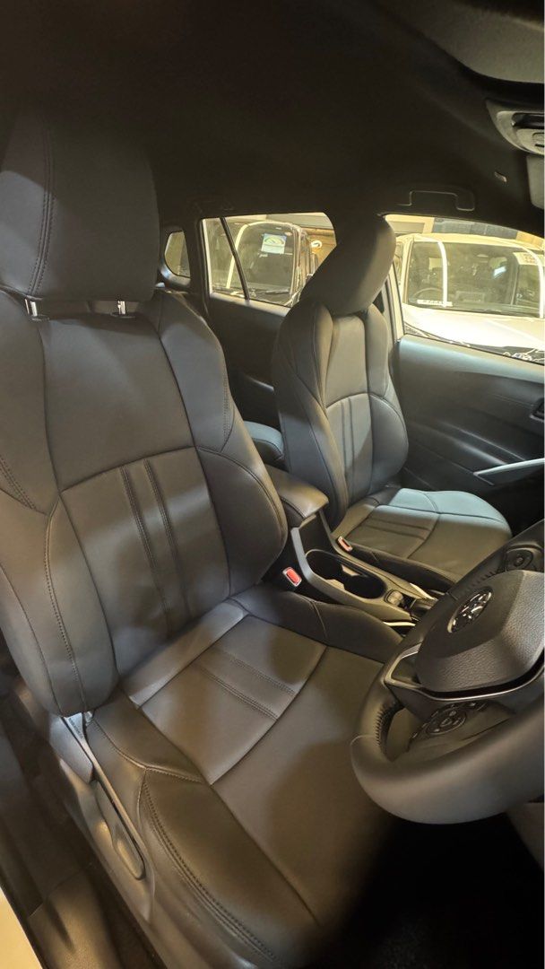 Toyota Corolla Cross 1.8A (Category: Parallel Imports) located in Singapore. Submitted by autozenbykenz (Listing ID 1414928783, Image 5). Description: Key Features & Specs: Powertrain: 1.8L Petrol Engine + Electric Motor with E-CVT Transmission. Power: Around 138 horsepower. Efficiency: Excellent fuel economy 26.2 km/L Technology: Toyota Safety Sense (Pre-Collision, Lane Departure Alert, etc.), 8-inch Multimedia System, Apple CarPlay/Android Auto