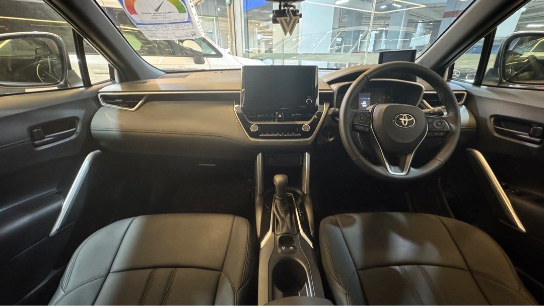 Toyota Corolla Cross 1.8A (Category: Parallel Imports) located in Singapore. Submitted by autozenbykenz (Listing ID 1414928783, Image 3). Description: Key Features & Specs: Powertrain: 1.8L Petrol Engine + Electric Motor with E-CVT Transmission. Power: Around 138 horsepower. Efficiency: Excellent fuel economy 26.2 km/L Technology: Toyota Safety Sense (Pre-Collision, Lane Departure Alert, etc.), 8-inch Multimedia System, Apple CarPlay/Android Auto
