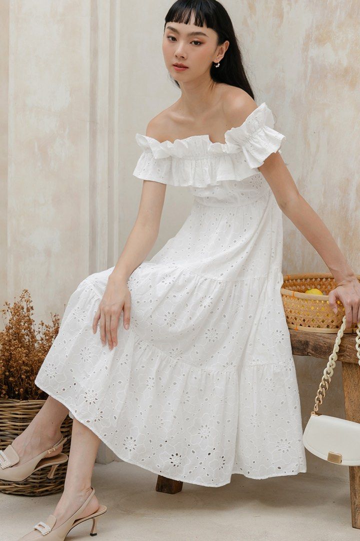 Fashmob MYKA EMBROIDERY OFF SHOULDER MIDI IN WHITE (Category: Dresses) located in Singapore. Submitted by kimmythrifts (Listing ID 1413454487, Image 1). Description: ❤️Brand new ❤️Size XS in white ❤️RTP $65 ❤️Tracked mailing +$3 - White off-shoulder dress - Intricate floral embroidery - Laser-cut eyelet pattern - Elastic ruffled shoulder details - Flattering A-line flare skirt - Functional side pockets - Concealed side zip - Fully lined.