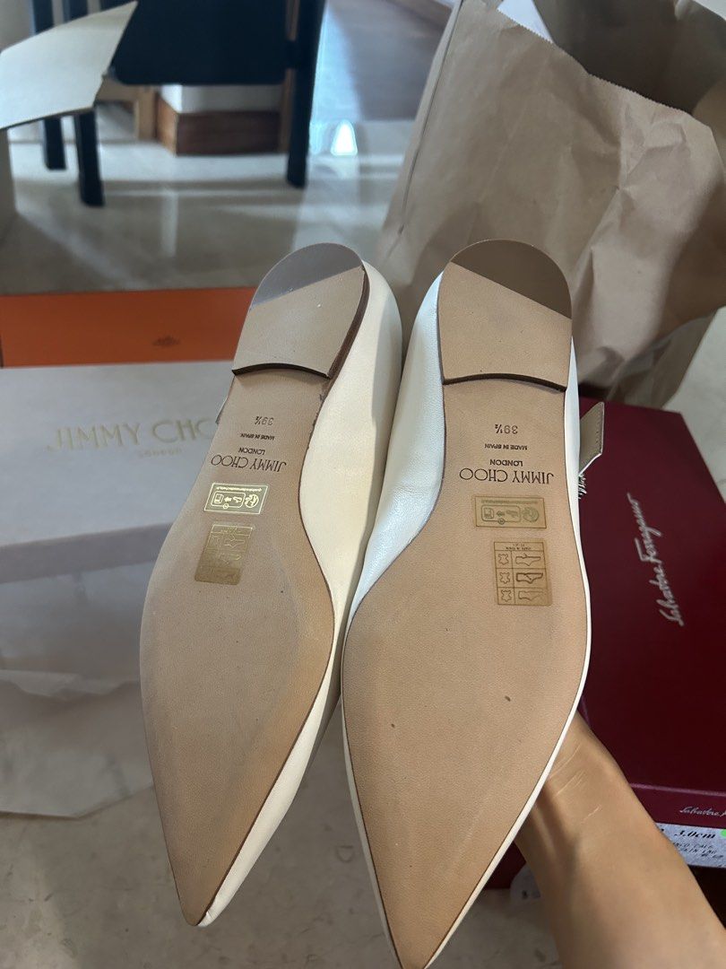 Jimmy Choo Cheri Flat - Milk - Size 39.5 (Category: Flats) located in Singapore. Submitted by 011284lynn (Listing ID 1421830373, Image 2). Description: - Brand new Jimmy Choo Cheri Flat - Color: Milk - Size: 39.5 - Features a crystal buckle - Comes with original box and packaging - Never worn.