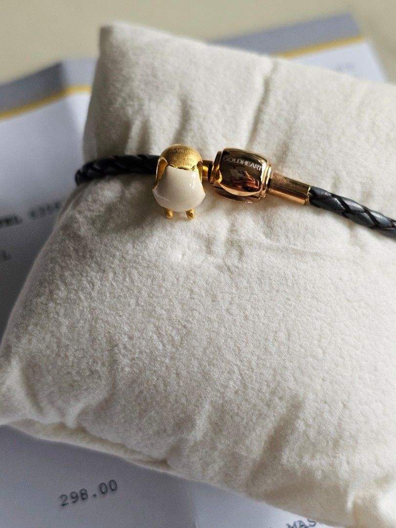 999 goldheart charm (Category: Charms) located in Singapore. Submitted by pompom2021 (Listing ID 1425915526, Image 3). Description: 999 24k goldheart gudetama charm. Goldheart retailing @ $298 in 2019 as per receipt. If keen in the goldheart bracelet, am selling it at $9..