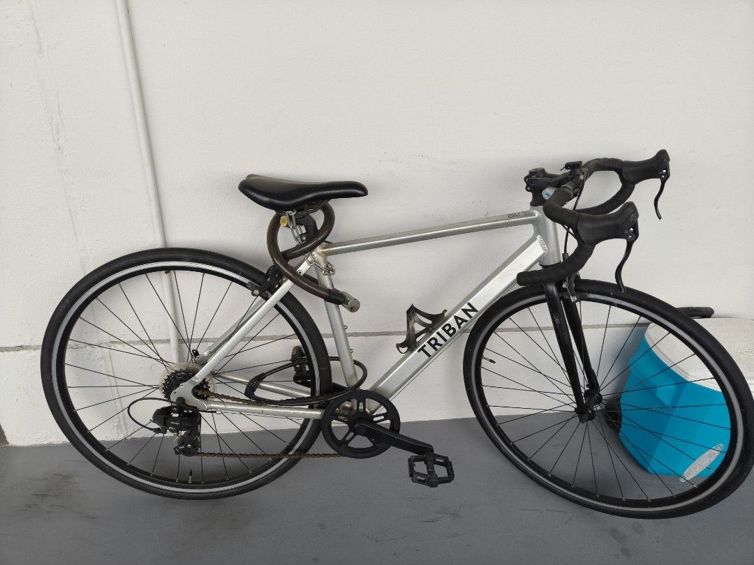 Triban Road Bike - Silver (Category: Bicycles) located in Singapore. Submitted by czplumbingservices (Listing ID 1427855851, Image 1). Description: Self collection at Jurong west st 41 Pls check the price before you pm and fast deal pls do not pm me if you can't match the price stated , delivery fee $70. Do not want to waste time if you not keen to buy tks. I do not know the size you may refer to the picture.