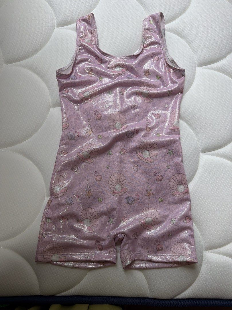 Pink Shell Print Gymnastics Leotard (Category: Babies & Kids Fashion) located in Singapore. Submitted by cassandrahan (Listing ID 1433062058, Image 1). Description: - length 57cm (shoulder to crotch) - Adorable pink Shell print design - One-piece with short legs - Tank straps - Slight shimmer.