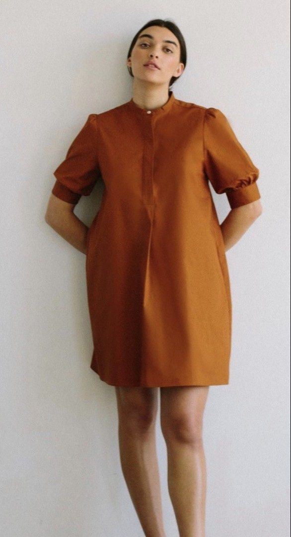 Brown Mini Dress with Puff Sleeves (Category: Dresses) located in Singapore. Submitted by btc2020 (Listing ID 1434106693, Image 3). Description: - Stylish brown mini dress - Features a mandarin collar and puff sleeves - Relaxed, comfortable fit - Button-down front - Flattering silhouette - Versatile for casual or dressed-up looks - super like it’s back design .