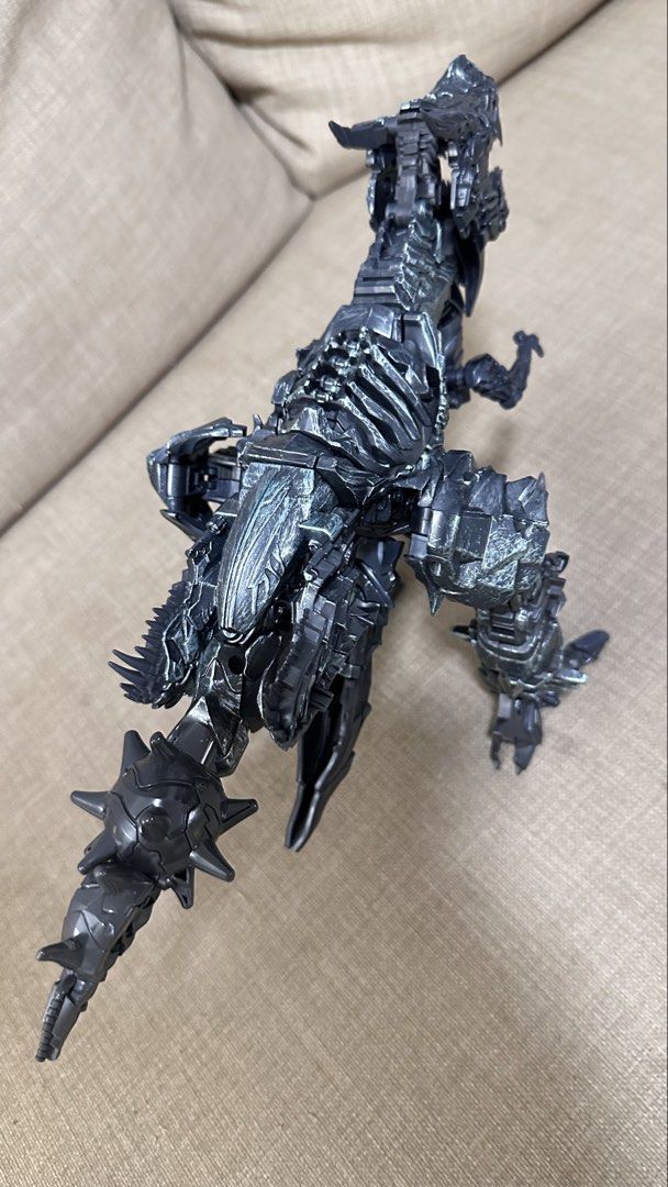 Transformers Grimlock Action Figure (Category: Toy Figures) located in Singapore. Submitted by yassha (Listing ID 1438144402, Image 5). Description: - Transformers Grimlock action figure - Transforms from robot to T-Rex - Detailed sculpting and articulation - Perfect for collectors and kids.