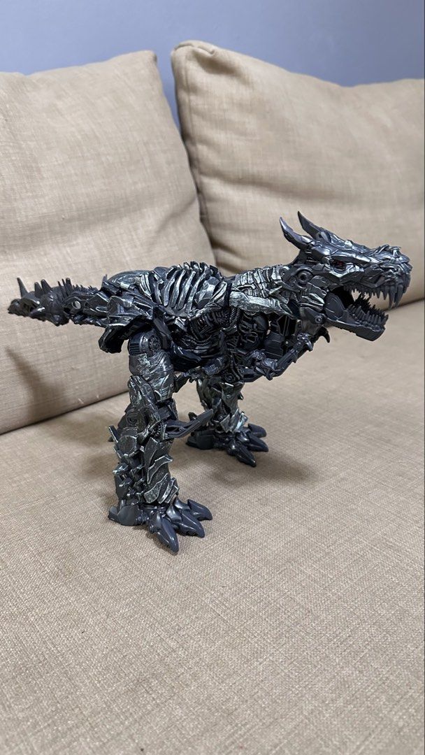 Transformers Grimlock Action Figure (Category: Toy Figures) located in Singapore. Submitted by yassha (Listing ID 1438144402, Image 4). Description: - Transformers Grimlock action figure - Transforms from robot to T-Rex - Detailed sculpting and articulation - Perfect for collectors and kids.