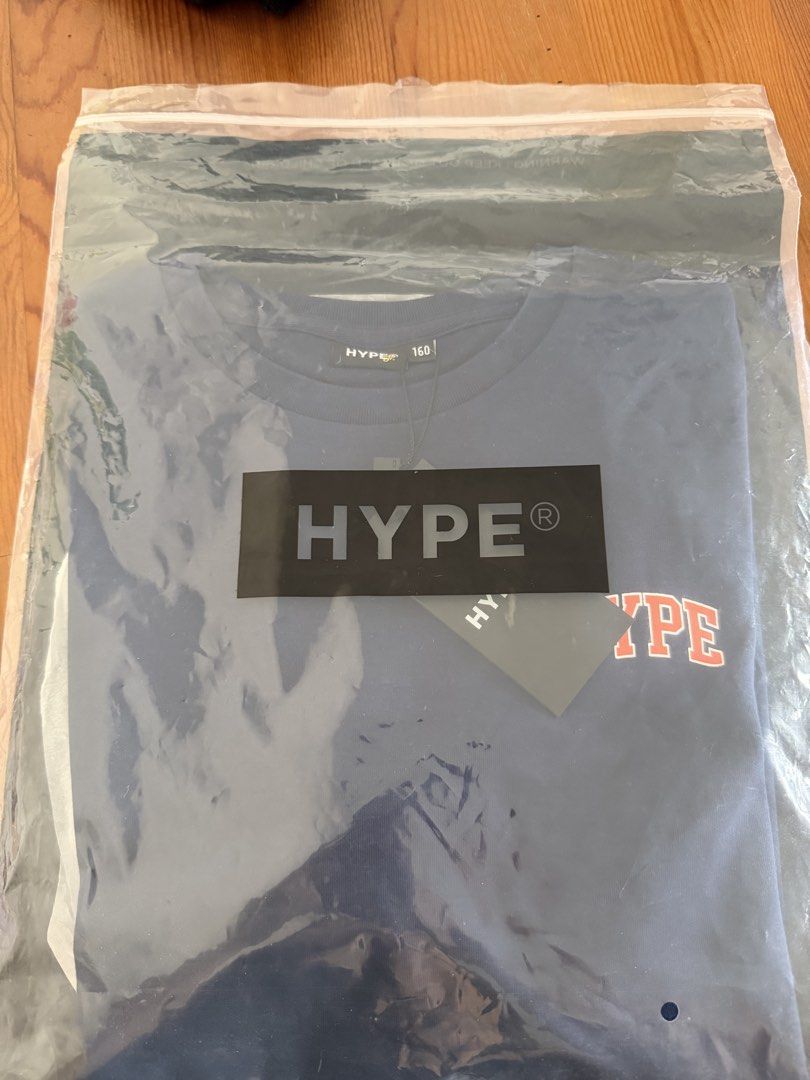 HYPE Navy Blue T-shirt - Size 160 - Brand New (Category: Babies & Kids Fashion) located in Singapore. Submitted by jr2224 (Listing ID 1438338943, Image 3). Description: - Brand new HYPE T-shirt - Navy blue color - Orange HYPE logo on front - Size 160 - With original tags - Perfect for casual wear Bought wrong size.