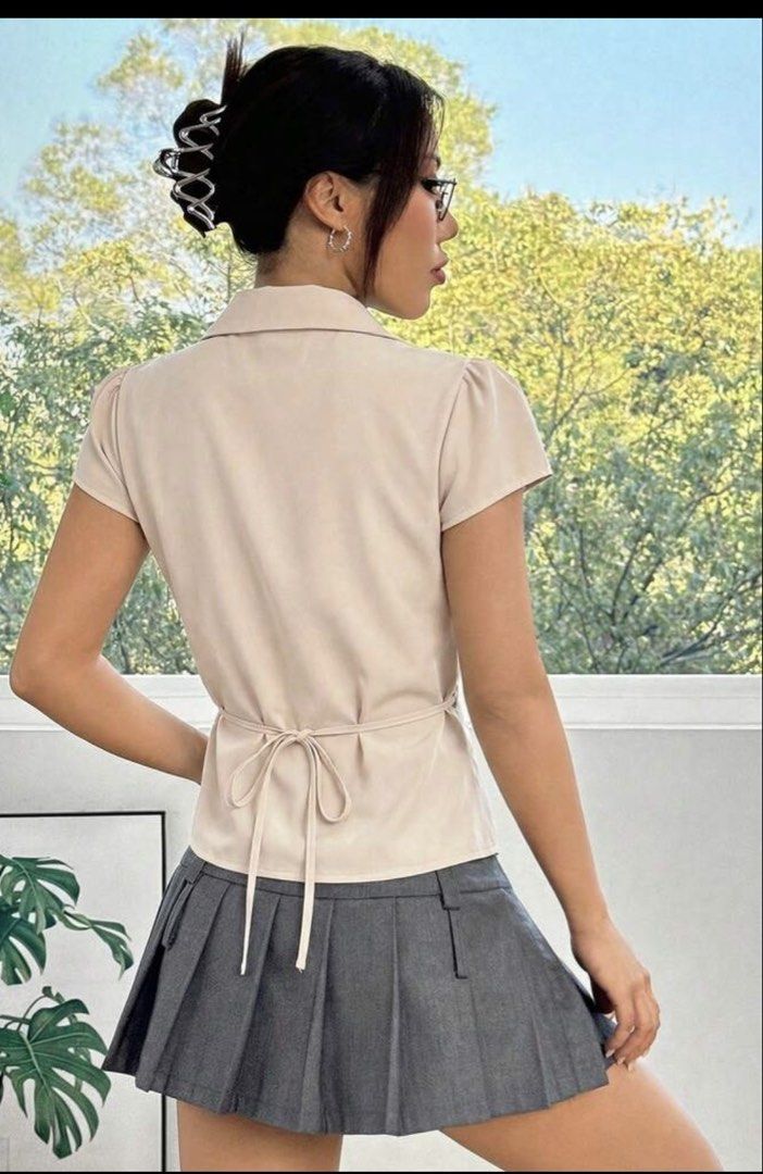 Ruched Button-Up Short Sleeve Shirt (Category: Blouses) located in Singapore. Submitted by skibidisussss (Listing ID 1440346225, Image 2). Description: can fit XS-S shoulder is 37.0cm, bust is 94.5cm,waist is 81.5cm , length is 54/49.5cm and sleeve length is 14.0cm! i need to sell this asap so if int pls dm me ! .