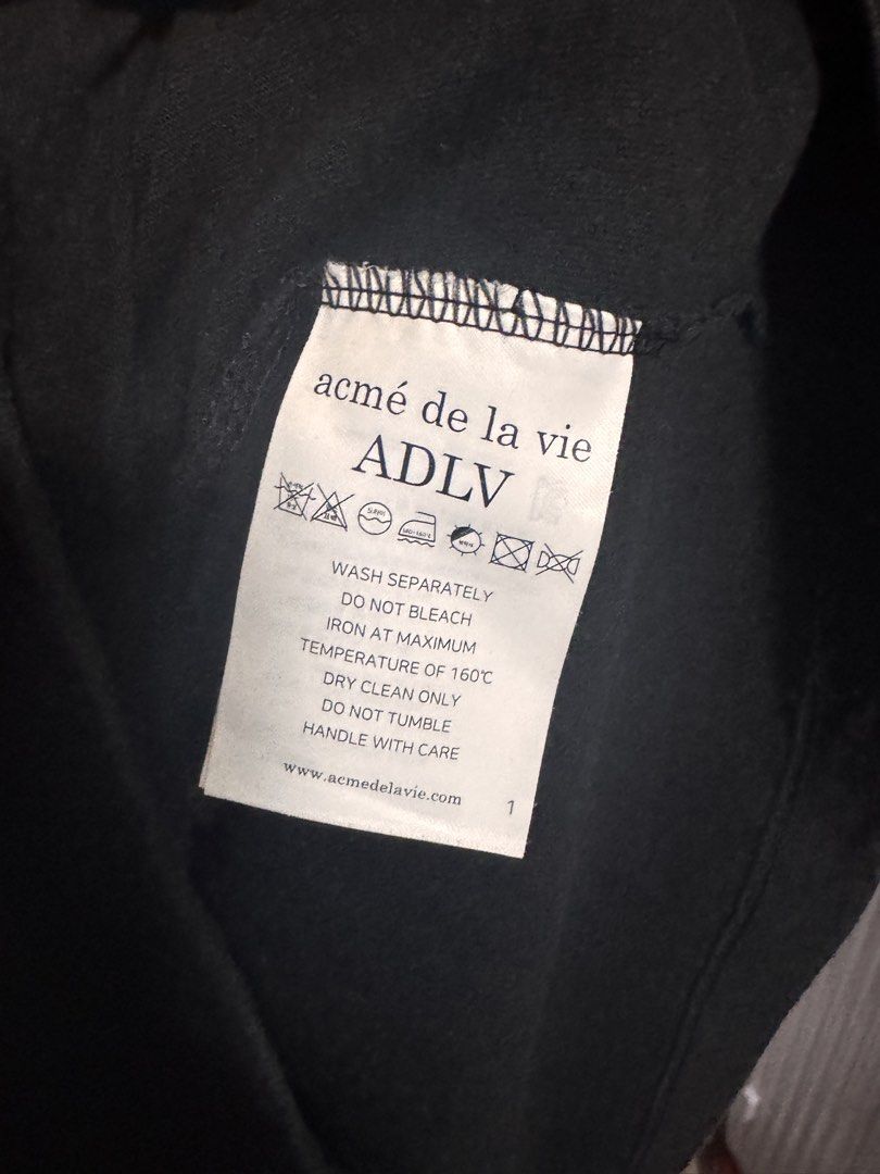 ADLV Acme De La Vie Lisa Collab Teddy Bear T-shirt (Category: Tshirts & Polo Shirts) located in Singapore. Submitted by xyjess (Listing ID 1436496523, Image 5). Description: - Authentic ADLV T-shirt - Size 1 - Black color - Features a teddy bear graphic on the back - Refer to care label for washing instructions.