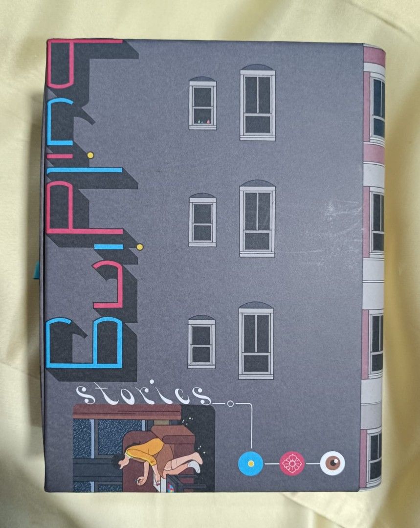 1000 pc Chris Ware Building Stories Jigsaw Puzzle Original Surprise (Category: Board Games & Puzzles) located in Singapore. Submitted by kittyleekityin (Listing ID 1443268408, Image 2). Description: Brand new. Inner bag unopened. When assembled , puzzle is 19 x 24 inch. Box art resembles a building; with pull-out drawer. Completely original puzzle piece shapes (designed by Chris Ware). Contains a few surprises and discoveries unlike any puzzle..