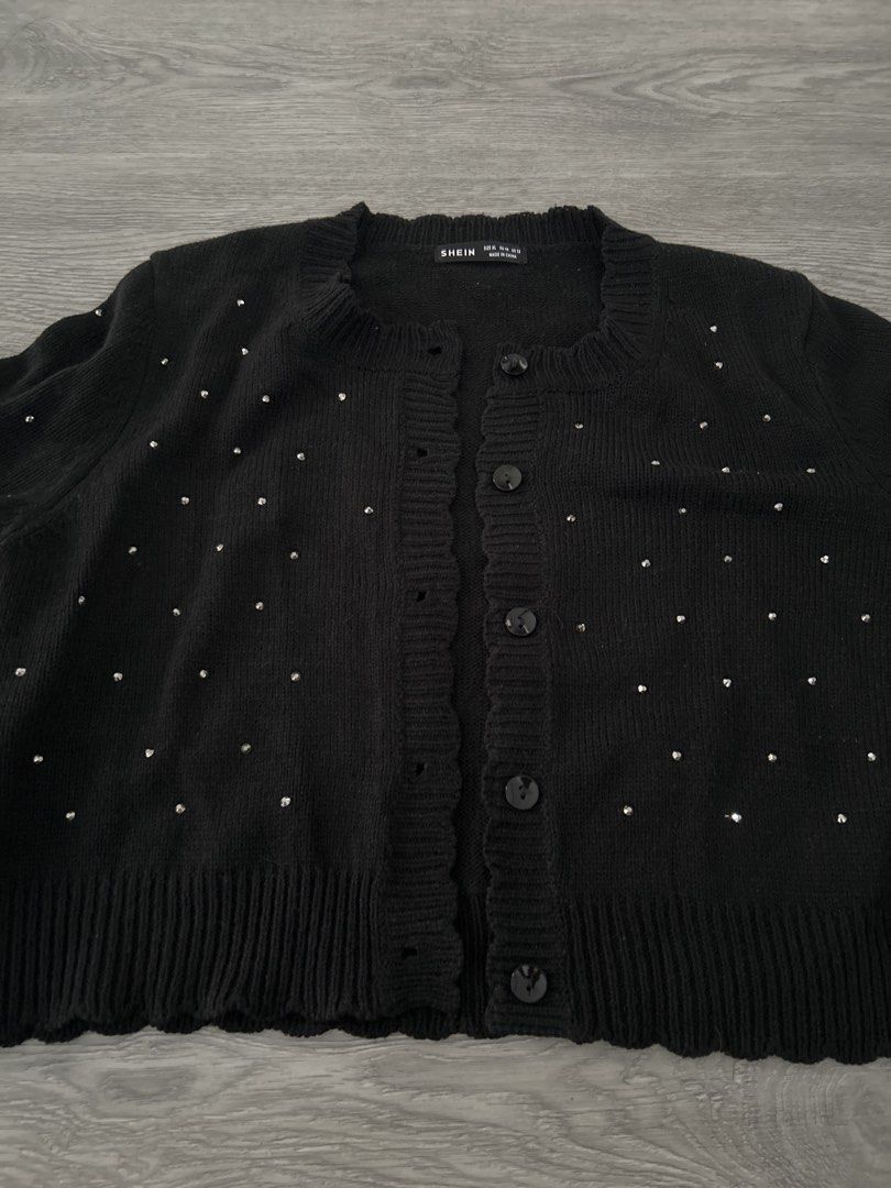 SHEIN Black Rhinestone Button Up Cardigan (Category: Coats, Jackets and Outerwear) located in Singapore. Submitted by kohyixin (Listing ID 1444713442, Image 1). Description: - Cute black cardigan from SHEIN - Features scattered rhinestones all over - Button closures down the front - Scalloped edge neckline and hem - Long sleeves - Ideal for layering.