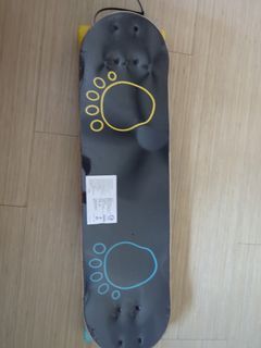 Skateboard with Monster Graphic and Paw Prints