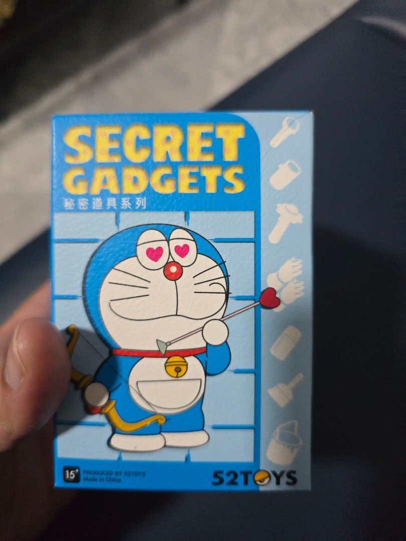 WTT Doraemon Secret Gadgets Blind Box Toy (Category: Designer & Blind Box Toys) located in Singapore. Submitted by letitgo89 (Listing ID 1445381264, Image 3). Description: - Doraemon Secret Gadgets Blind Box - Design: Shrink Ray - BNIF; inner card - Ideal for Doraemon collectors and fans - WTT to those not crossed out.