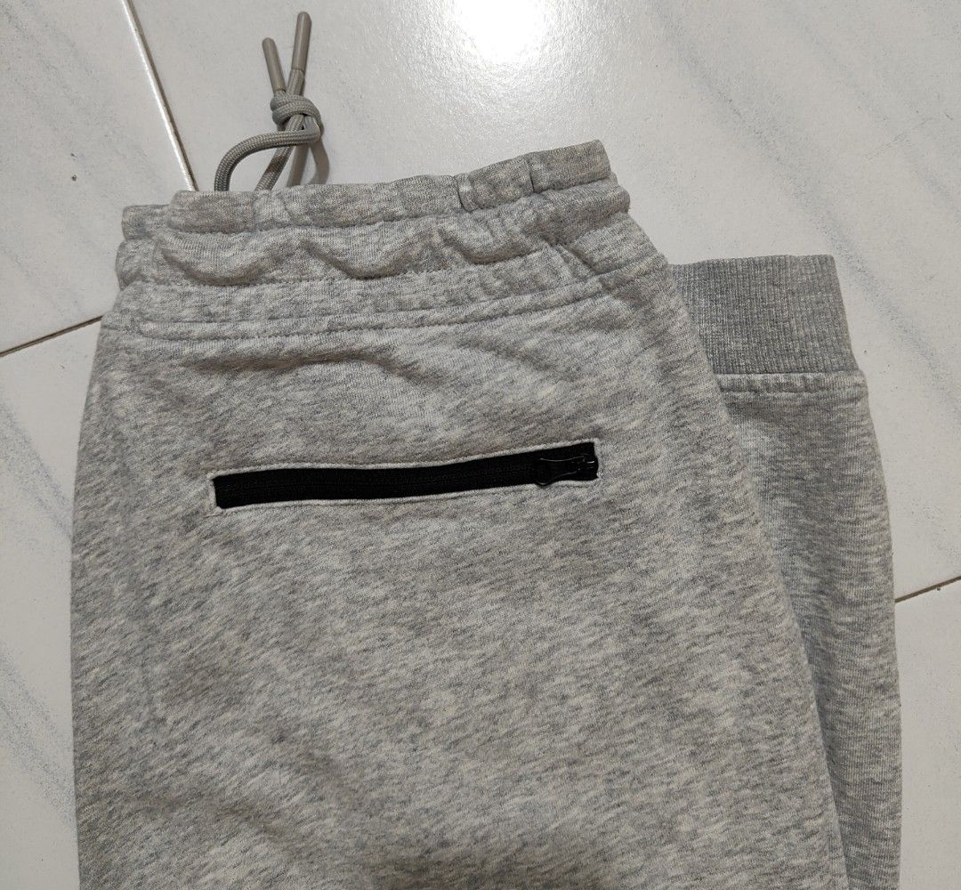 Grey Sweatpants - L (165/68A) (Category: Activewear) located in Singapore. Submitted by blueskybeautifulclouds (Listing ID 1445671546, Image 2). Description: - Grey, L (165/68A) - Elastic waistband with drawstring - Two side pockets + zipper back pocket - Ribbed cuffs at the ankles - Measurements - Waist: 30cm (Dia) / Hip: 57.5cm (Dia) / Length: 95.5cm / Cuff: 13.5cm (Dia) .