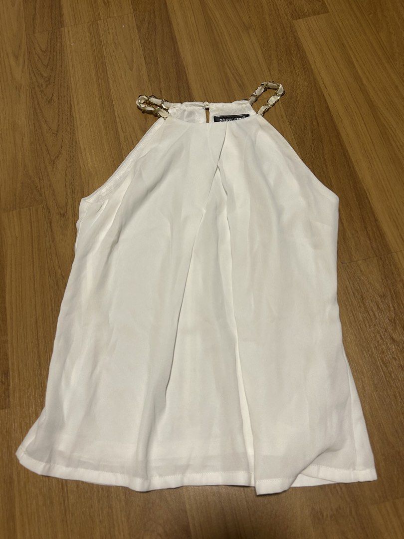White elegant top (Category: Sleeveless) located in Singapore. Submitted by unicornlover11 (Listing ID 1448715366, Image 1). Description: .