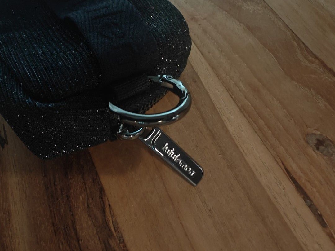 Lululemon Black Sparkle Everywhere Belt Bag Pouch (Category: Purses & Pouches) located in Singapore. Submitted by booli (Listing ID 1449373180, Image 4). Description: - Black Lululemon pouch with a subtle sparkle - Zipper closure for secure storage - Back loop and clip for versatile attachment (belt/bag) - Iconic Lululemon logo on the front - Brand new with original tags attached - Ideal size for carrying small essentials.