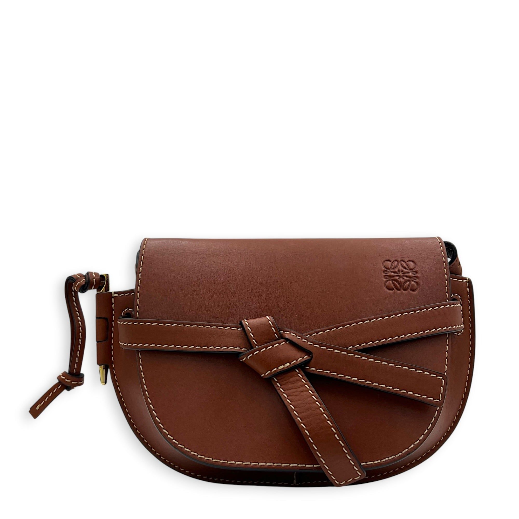 Loewe Gate Crossbody Bag Brown in Calfskin (Category: Bags & Wallets) located in Singapore. Submitted by carousellluxury (Listing ID 1451033547, Image 1). Description: SKU C2607-013365LL Material Calfskin Color Brown Strap Not Included Dimension (L)21cm × (H)12.5cm × (W)9.5cm Accessories Dust Bag, Series 522111 Circa Est 2021 Microchipped FALSE Condition - Surface: Slight scratches - Bottom Edge / Base / Bagfeet: Small scuff - Handle / Strap: In 
