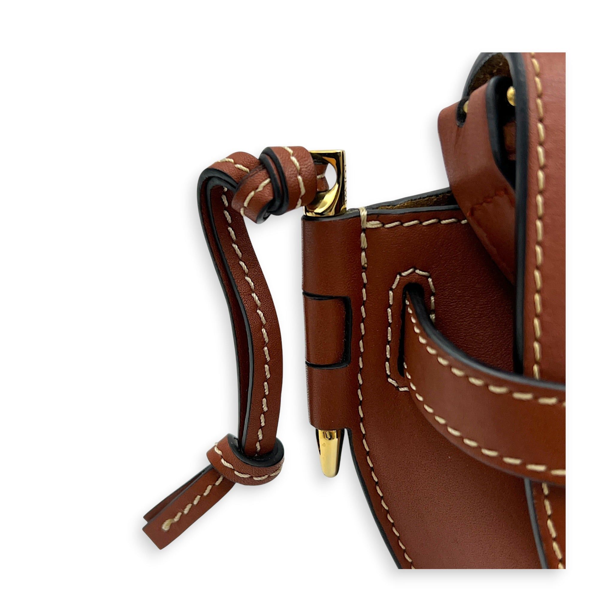 Loewe Gate Crossbody Bag Brown in Calfskin (Category: Bags & Wallets) located in Singapore. Submitted by carousellluxury (Listing ID 1451033547, Image 8). Description: SKU C2607-013365LL Material Calfskin Color Brown Strap Not Included Dimension (L)21cm × (H)12.5cm × (W)9.5cm Accessories Dust Bag, Series 522111 Circa Est 2021 Microchipped FALSE Condition - Surface: Slight scratches - Bottom Edge / Base / Bagfeet: Small scuff - Handle / Strap: In 