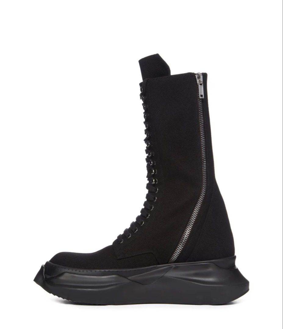 RICK OWENS EDFU DENIM CARGO ARMY ABSTRACT BOOTS (Category: Boots) located in Singapore. Submitted by notasaint (Listing ID 1452027400, Image 3). Description: SS23. THESE ARMY ABSTRACTS ARE BELOW KNEE HEIGHT AND FEATURE EIGHT EYELETS ON THE FOOT AND ELEVEN METAL TABS, FOR LACING, ON THE SHIN. THEY HAVE LONG LACES, A HIGH TONGUE, TOPSTITCHED PANELS ON THE FOOT AND HEEL, A ZIPPER ON THE INSIDE ANKLE FOR EASY FASTENING, TOE CAPS AND A VOLUMINOUS RUBB