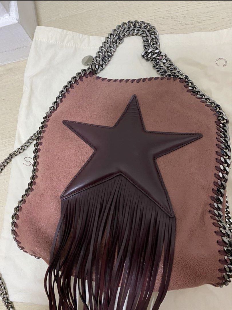 Stella McCartney Star Fringed Shoulder Bag (Category: Bags & Wallets) located in Singapore. Submitted by missmhappy (Listing ID 1452418141, Image 3). Description: - Authentic Stella McCartney bag - Features star detail and fringe - Silver chain strap - Comes with dust bag - Perfect for nights out or everyday flair.