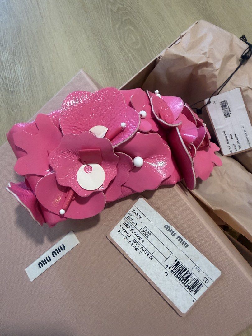 BN Authentic MIU MIU Runway headband Pink retro embellished flower accessories (Category: Accessories) located in Singapore. Submitted by slashstash (Listing ID 1452982478, Image 3). Description: - Brand new Authentic Miu Miu runway headband in pink (verify online and photos) - Features retro-inspired embellished flowers and pearls, statement piece - Note on slight mark on the inner band, cant be seen if worn.