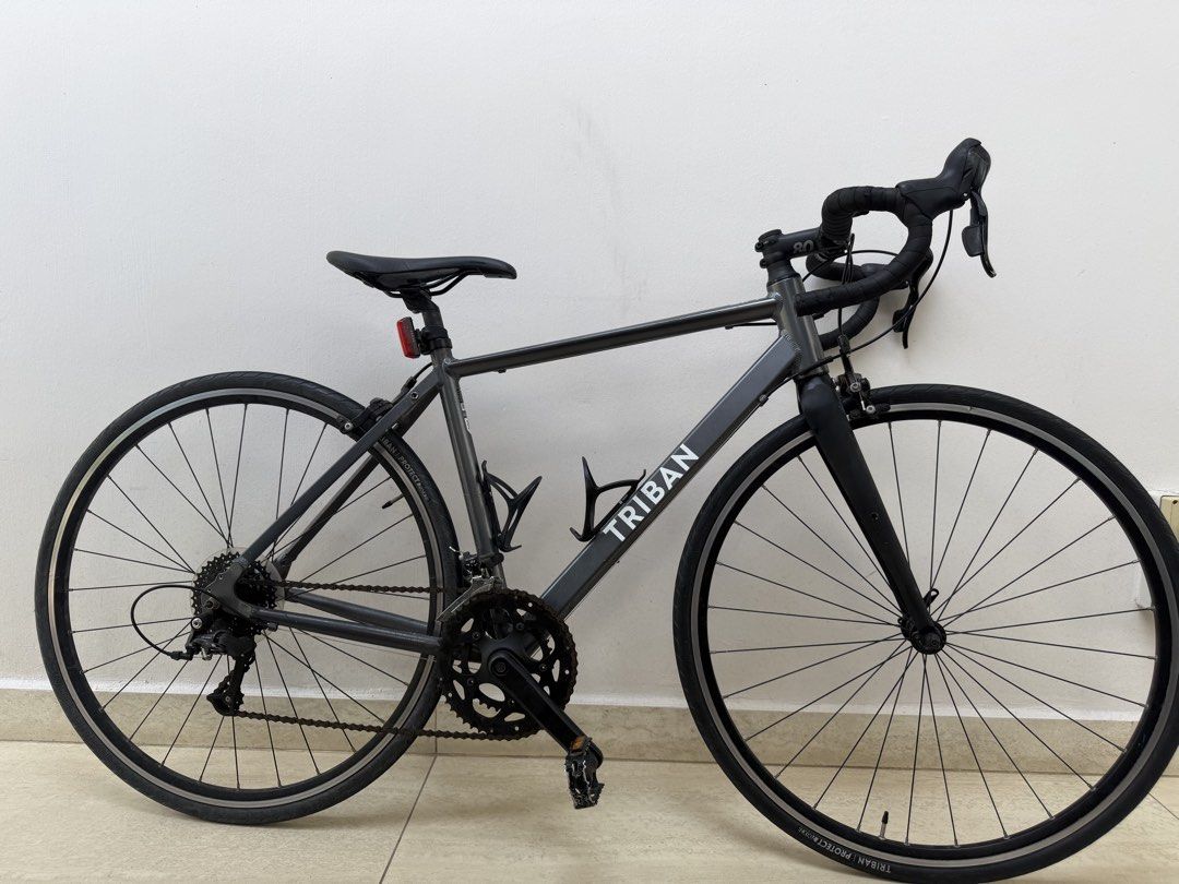 Triban RC120 Road Bike (Category: Bicycles) located in Singapore. Submitted by nimamameiyoumao. (Listing ID 1447939983, Image 1). Description: - Grey Triban Road Bike - Drop Handlebars - 2 Water Bottle Cages Included - Triban Protect+ Tires - Ideal for Commuting or Fitness Rides - Frame Size s RFS: want to upgrade I accept trades .