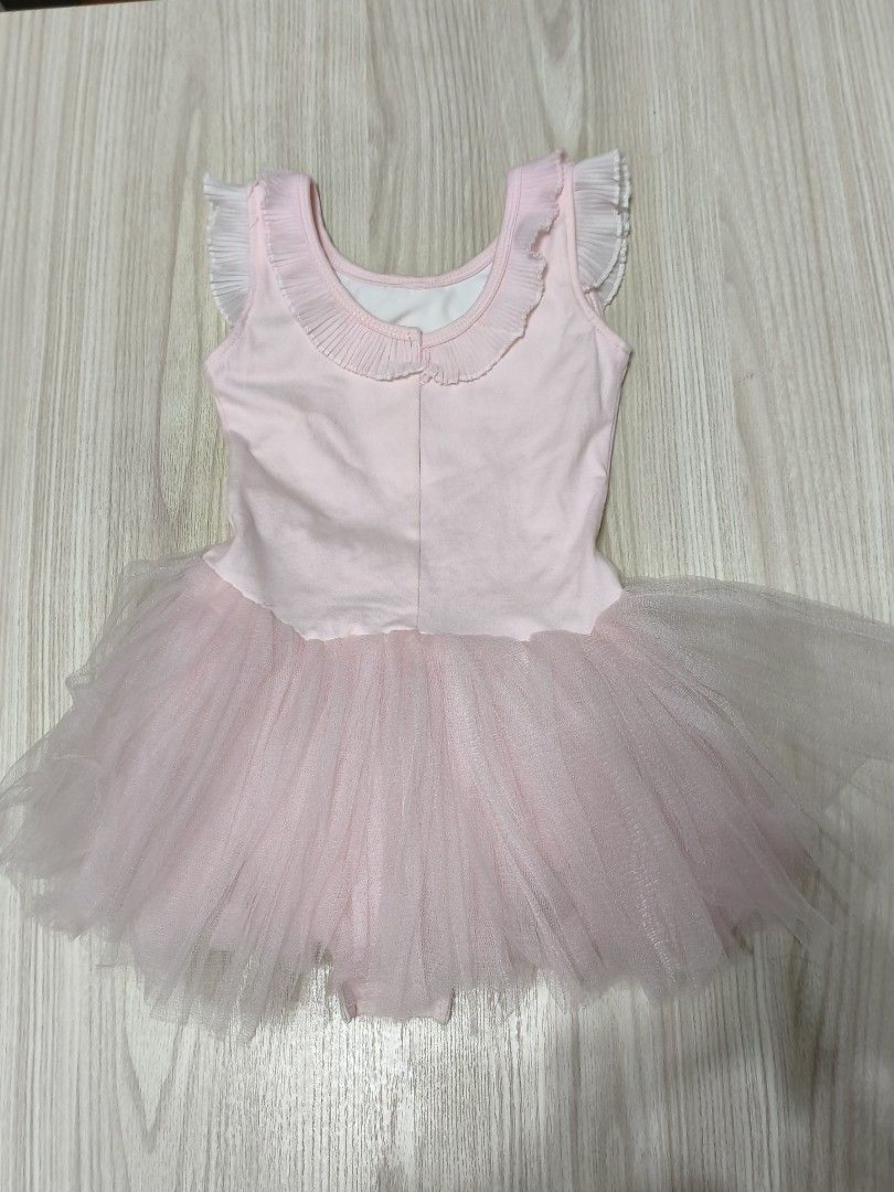 Baby Pink Ballet Tutu Dress with Bow (Category: Babies & Kids Fashion) located in Singapore. Submitted by gududeleng (Listing ID 1455607966, Image 4). Description: - Cute baby pink ballet tutu dress - Sleeveless with ruffled neckline - Large bow detail at the back - Soft tulle tutu skirt - Convenient snap closures for easy diaper changes - Ideal for dance class or imaginative dress-up play.