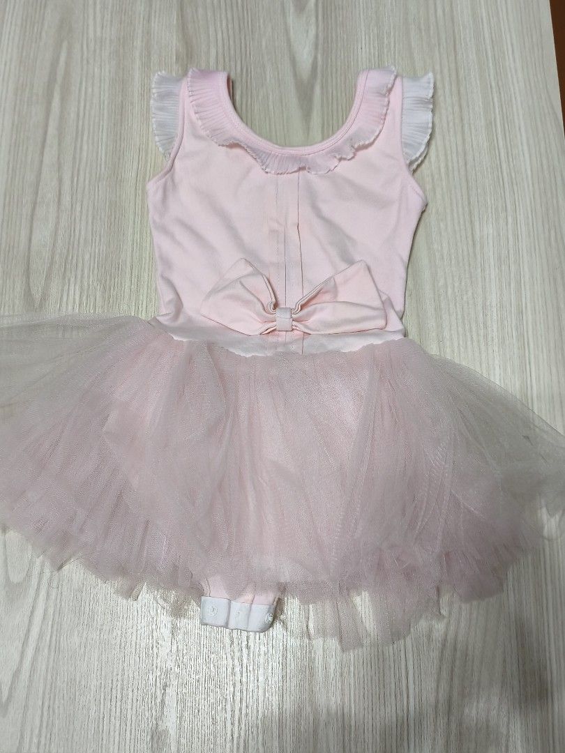 Baby Pink Ballet Tutu Dress with Bow (Category: Babies & Kids Fashion) located in Singapore. Submitted by gududeleng (Listing ID 1455607966, Image 2). Description: - Cute baby pink ballet tutu dress - Sleeveless with ruffled neckline - Large bow detail at the back - Soft tulle tutu skirt - Convenient snap closures for easy diaper changes - Ideal for dance class or imaginative dress-up play.