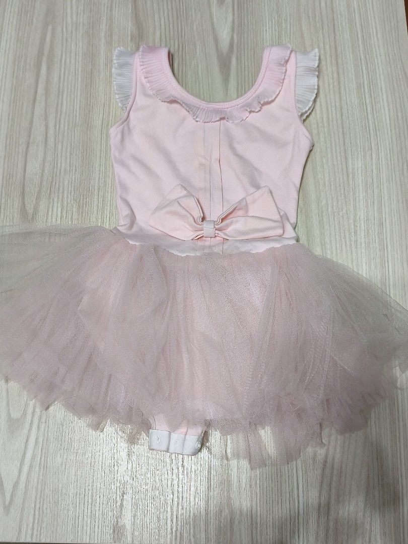 Baby Pink Ballet Tutu Dress with Bow (Category: Babies & Kids Fashion) located in Singapore. Submitted by gududeleng (Listing ID 1455607966, Image 1). Description: - Cute baby pink ballet tutu dress - Sleeveless with ruffled neckline - Large bow detail at the back - Soft tulle tutu skirt - Convenient snap closures for easy diaper changes - Ideal for dance class or imaginative dress-up play.