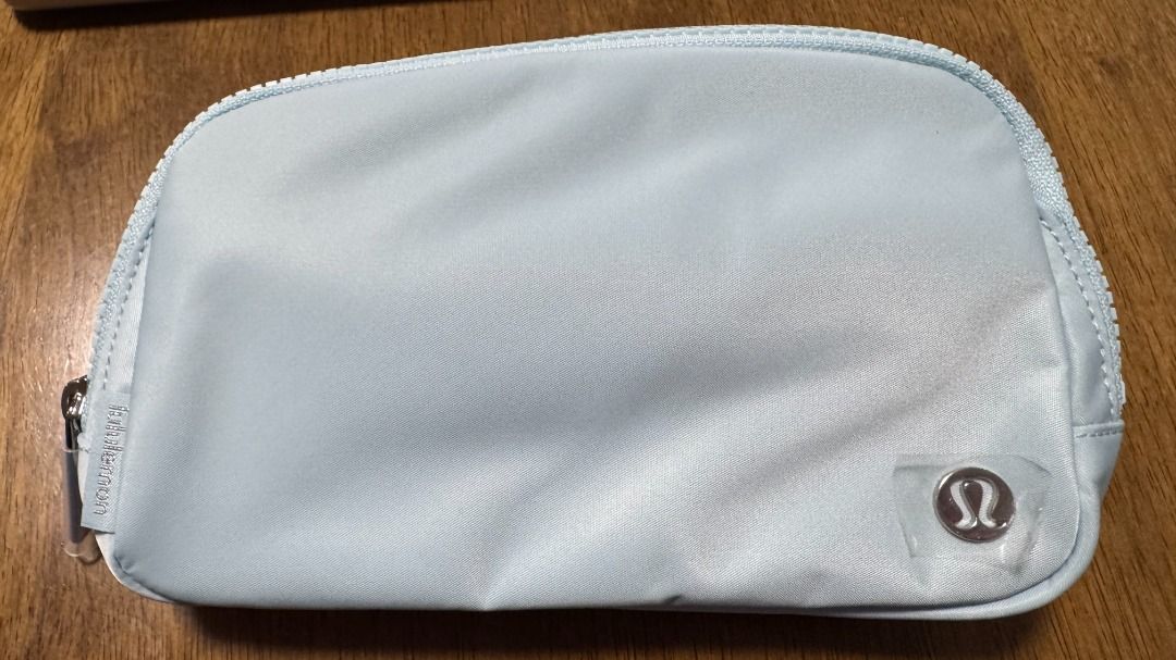 BNWT Lululemon Everywhere Belt Bag 1L in Foam Cloud/Silver (Category: Purses & Pouches) located in Singapore. Submitted by weiztay (Listing ID 1455771911, Image 2). Description: - Lululemon Everywhere Belt Bag - Zippered main compartment to secure your valuables - Interior mesh pocket for organization - Adjustable strap for a comfortable fit, tuck the excess belt bag strap into the elastic loops - Perfect for carrying essentials Bag dimensions: 1