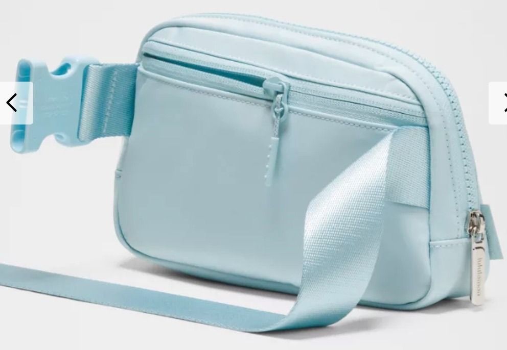 BNWT Lululemon Everywhere Belt Bag 1L in Foam Cloud/Silver (Category: Purses & Pouches) located in Singapore. Submitted by weiztay (Listing ID 1455771911, Image 4). Description: - Lululemon Everywhere Belt Bag - Zippered main compartment to secure your valuables - Interior mesh pocket for organization - Adjustable strap for a comfortable fit, tuck the excess belt bag strap into the elastic loops - Perfect for carrying essentials Bag dimensions: 1