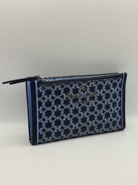 Kate Spade Blue link patterned lock bi fold card holder wallet (Category: Wallets & Card Holders) located in Singapore. Submitted by whitespade_ (Listing ID 1456009460, Image 1). Description: - Brand: Kate Spade - Type: Bi-fold card holder wallet - Design: Blue link pattern with gold 'Kate Spade New York' logo - Interior: Multiple card slots, clear ID window, zippered compartment, able to put coins and cards - Color: Blue and navy - Features: Com