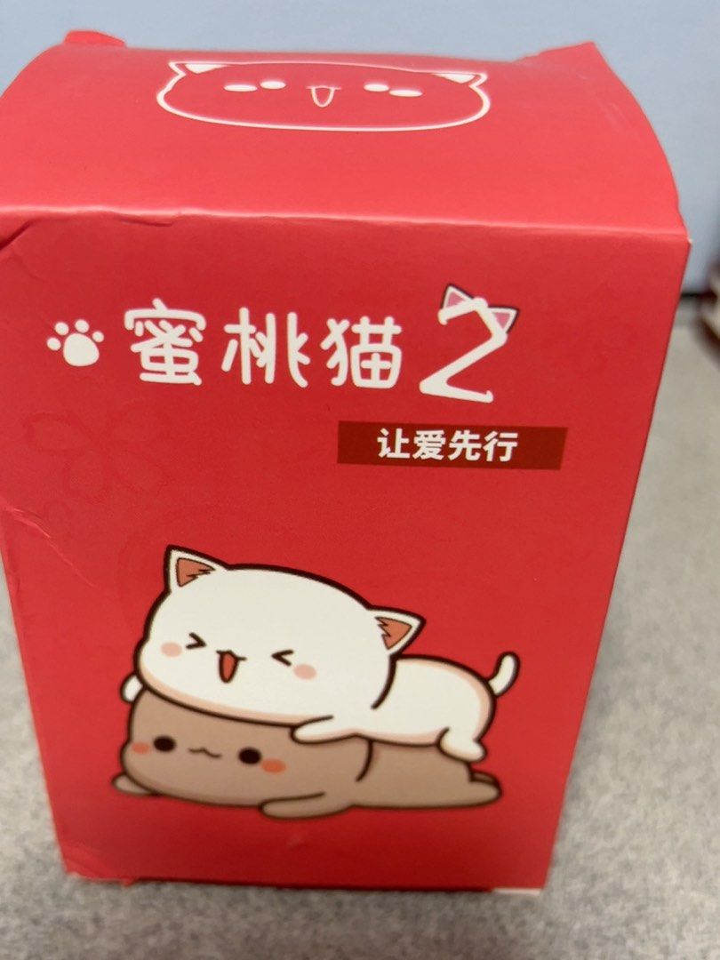 Peach Cat Blind Box Figures - Mochi Cat (Category: Designer & Blind Box Toys) located in Singapore. Submitted by jiaqiloh (Listing ID 1456523522, Image 2). Description: - Adorable Mochi Cat blind box figures - Set includes 2 cats - Comes with original box - Ideal for collectors or as a gift - Cute cat illustrations on the box.
