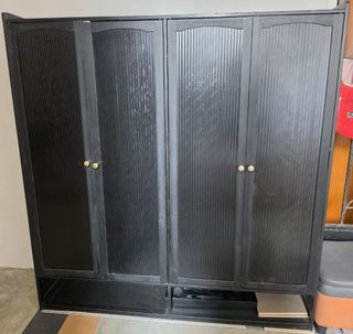 Black 4-Door Shoe Cabinet with Gold Knobs