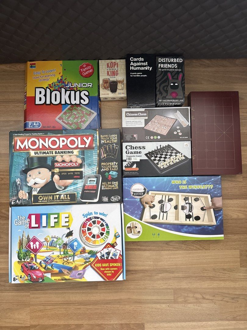 [Assorted Board Games] Monopoly, Blokus, Chess, and more! (Category: Board Games & Puzzles) located in Singapore. Submitted by lynniestuff (Listing ID 1456814050, Image 1). Description: **Price List** Junior Blokus - $5 Monopoly Ultimate Banking - $20 [SOLD] Kopi King - $18 Cards Against Humanity - $15 Disturbed Friends - $15 Chinese Chess - $5 Chinese Chess (Wood) - $20 Chess Game - $5 The Game of Life - $10 .